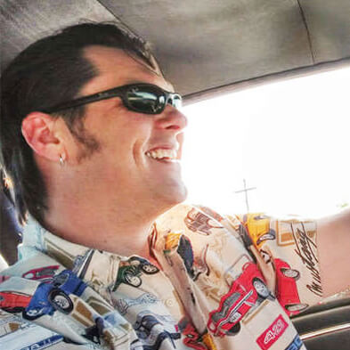 Blake driving in his car